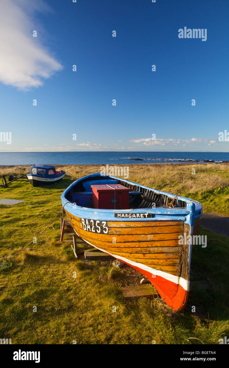 Boat beached on shore at Ballantrae, South Ayrshire, Scotland. Stock Photo