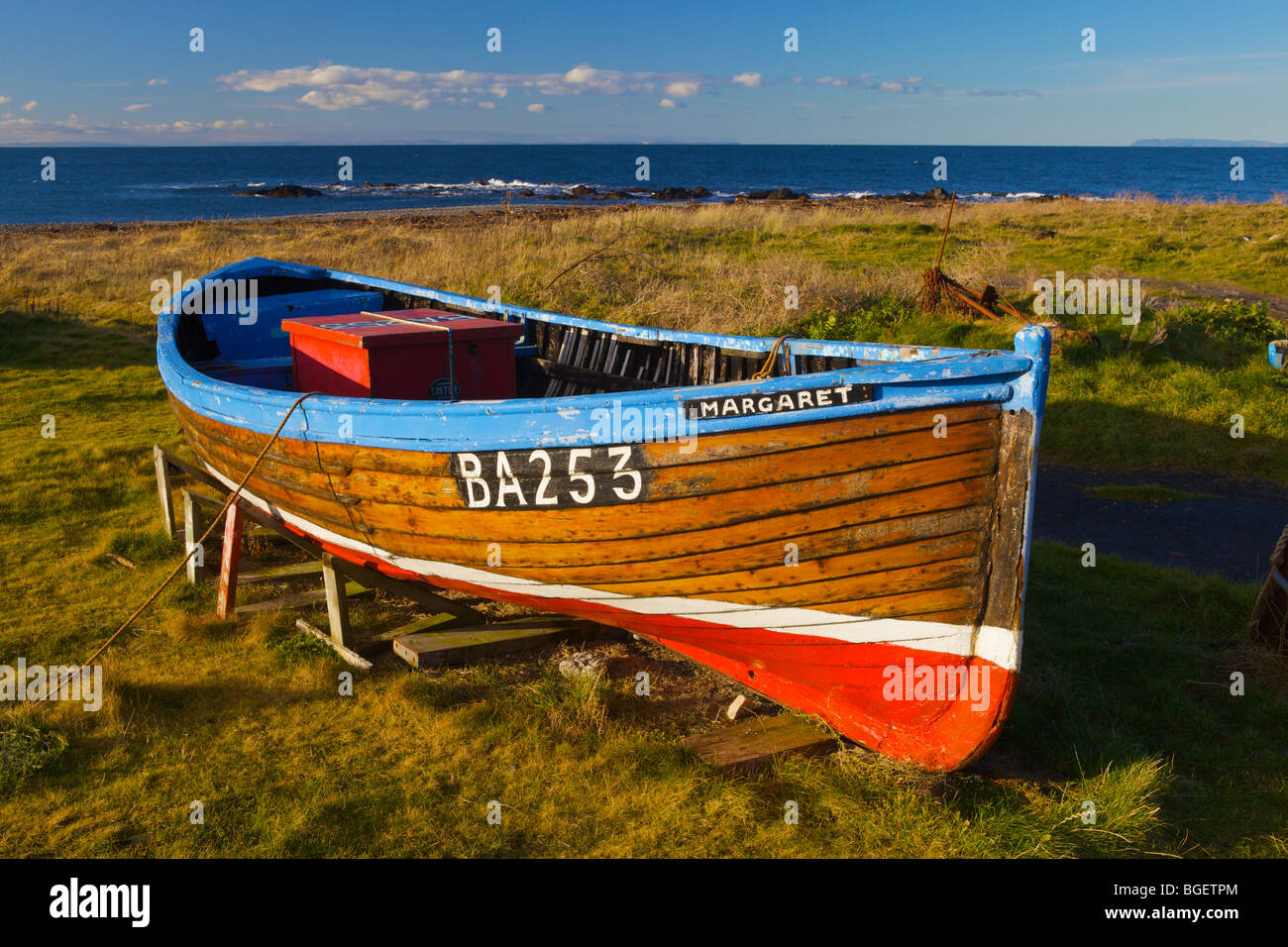Boat beached on shore at Ballantrae, South Ayrshire, Scotland. Stock Photo