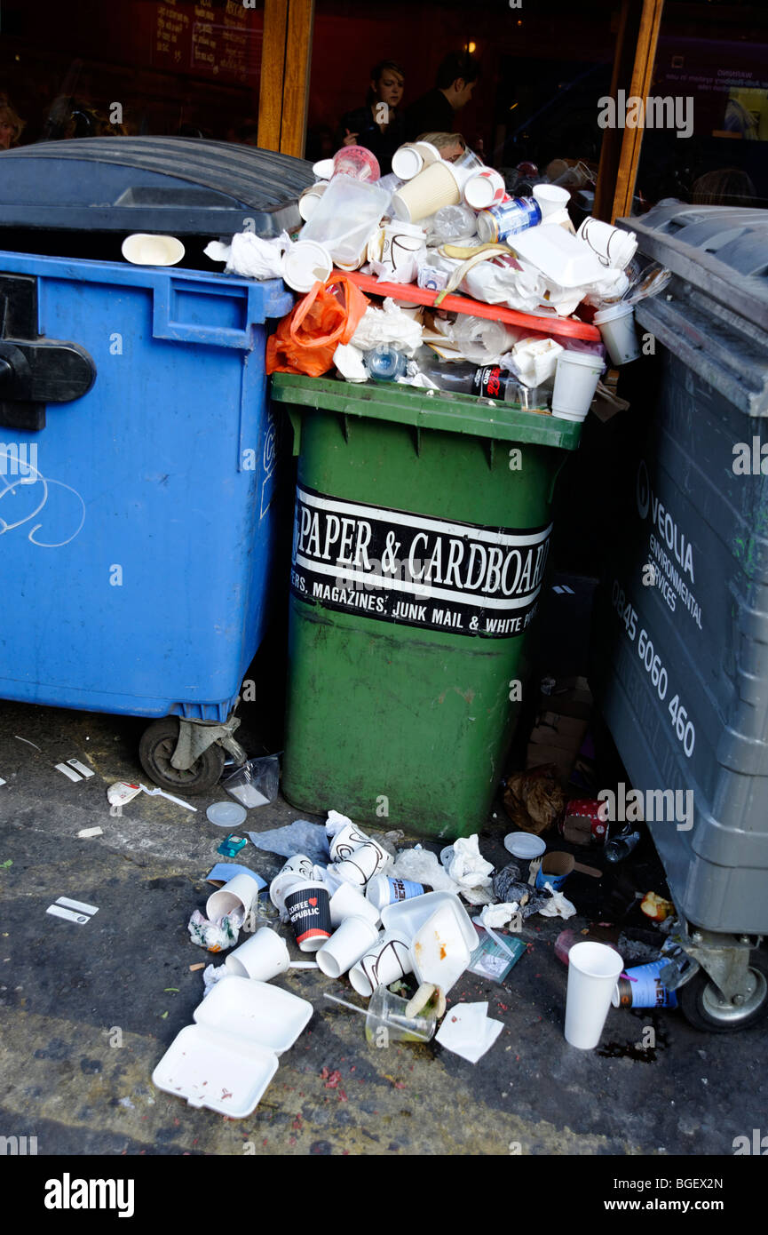 Overflowing recycling bin with mixed waste. London. Britain. UK Stock Photo