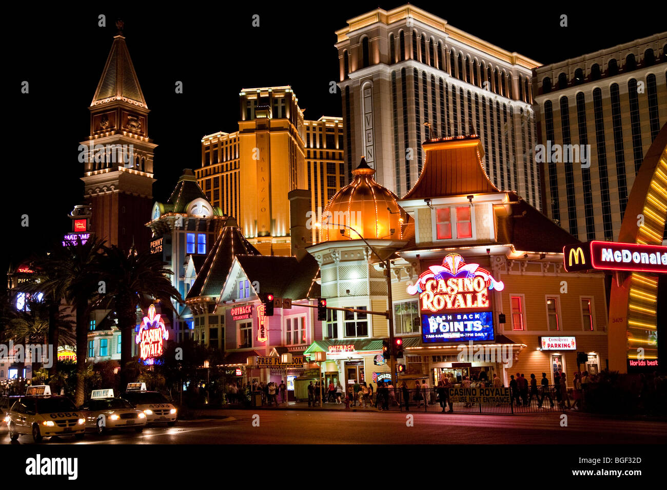 Las Vegas Strip at night with Venetian Hotel, Casino Royale and fast food outlets Stock Photo