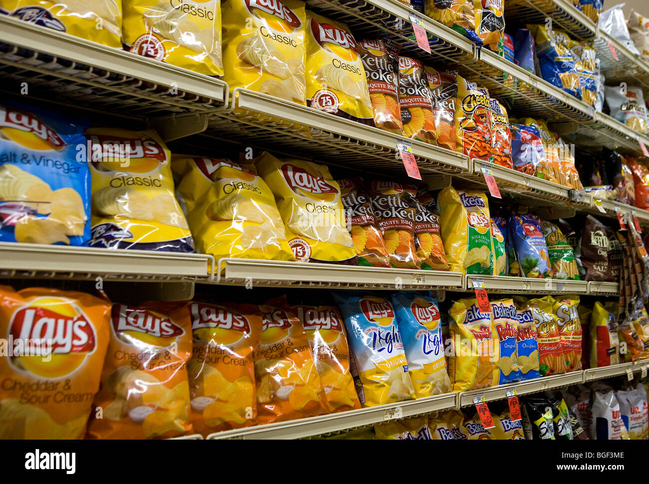 Potato chips on display in a grocery store.  Stock Photo