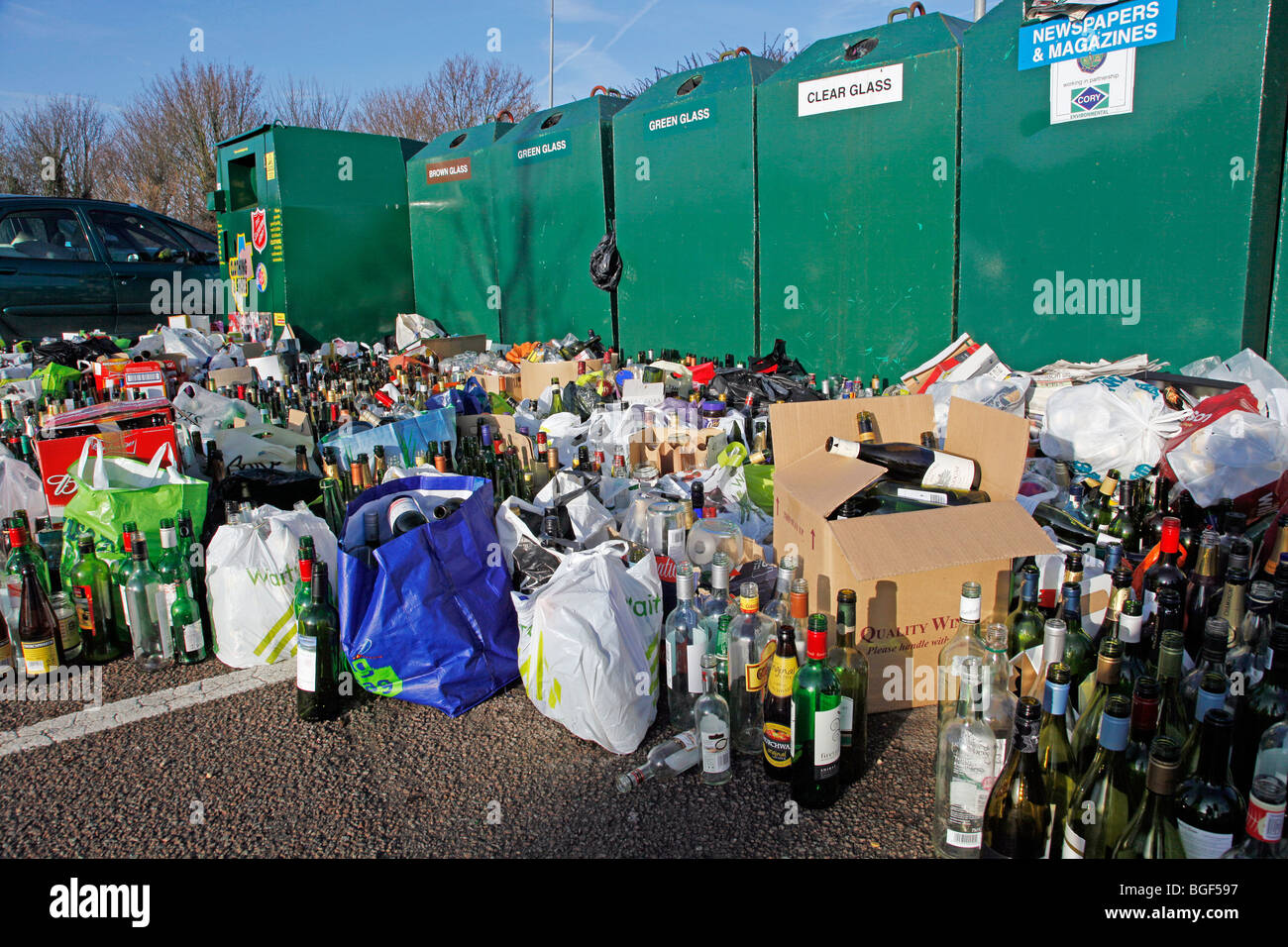 Overflowing bottle banks following Christmas festivities Stock Photo