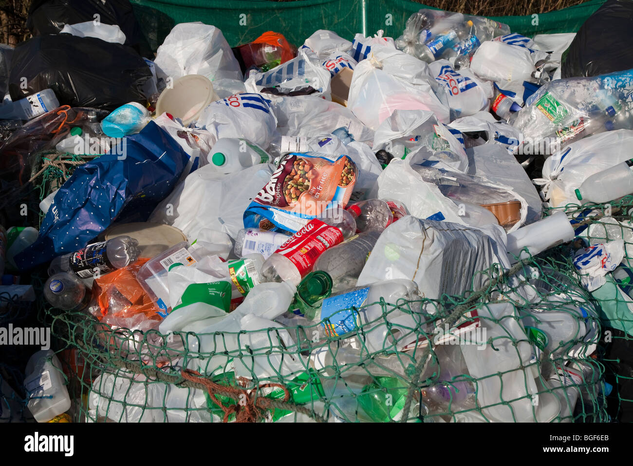 Waste at recycling station in car par UK Stock Photo