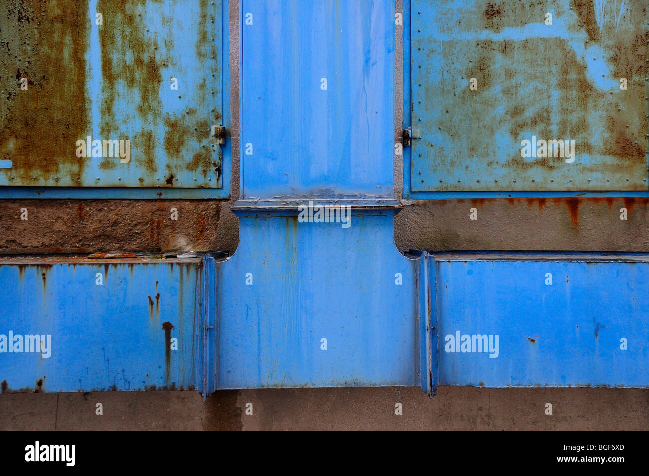 Detail of blue rusty ventilation ducts and metal doors Stock Photo