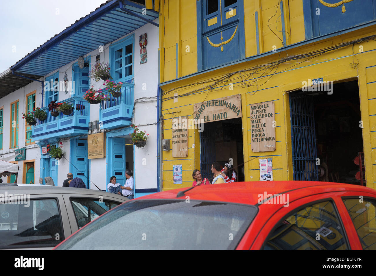 Salento, Colombia, central square with  cafes, restaurants, cars, parked, people, paisa, architecture, balconies, plants, people Stock Photo