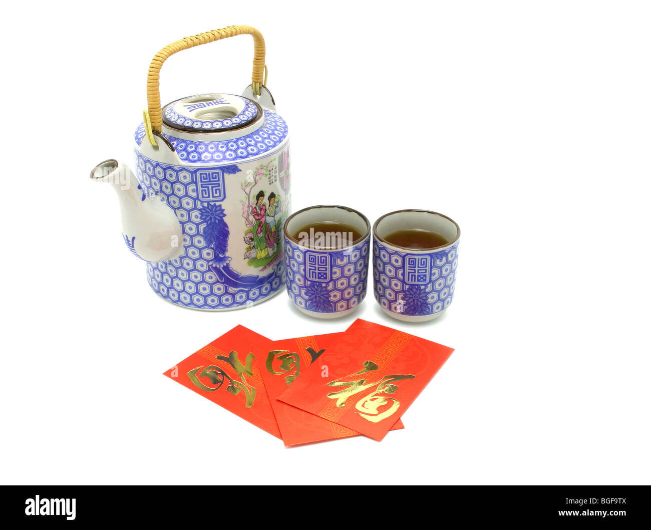 Chinese prosperity tea set and red packets for tea ceremony on white background Stock Photo