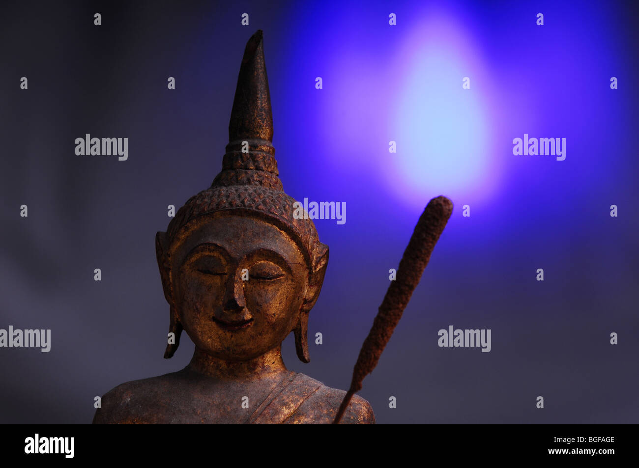 a budha statue with a match Stock Photo
