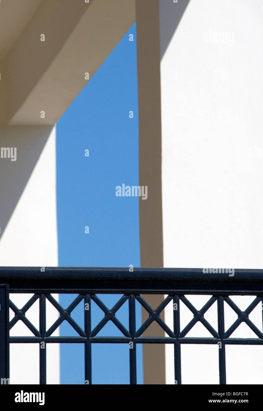 Geometric abstract composition , black railings, blue sky and white ...