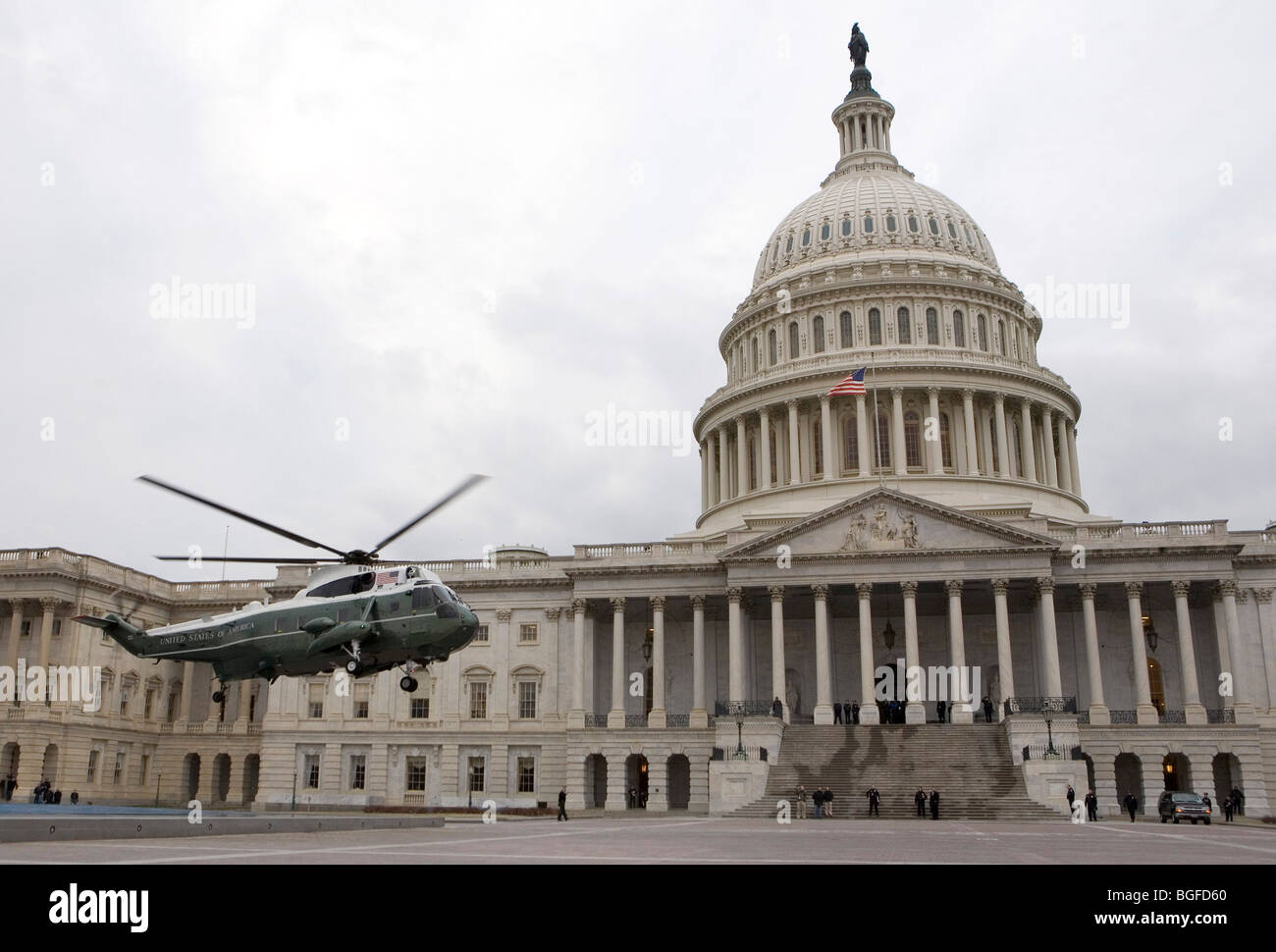 A Marine One helicopter practices a landing at the US Capitol Building. Stock Photo