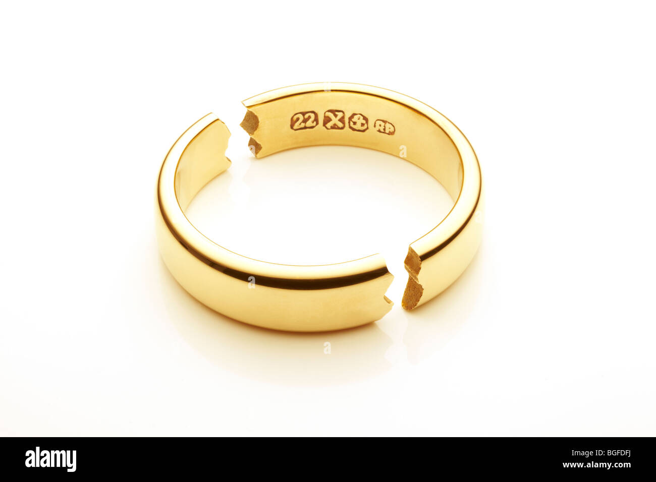 Broken Gold Wedding Ring Symbolizing Marriage Break Up Stock Photo