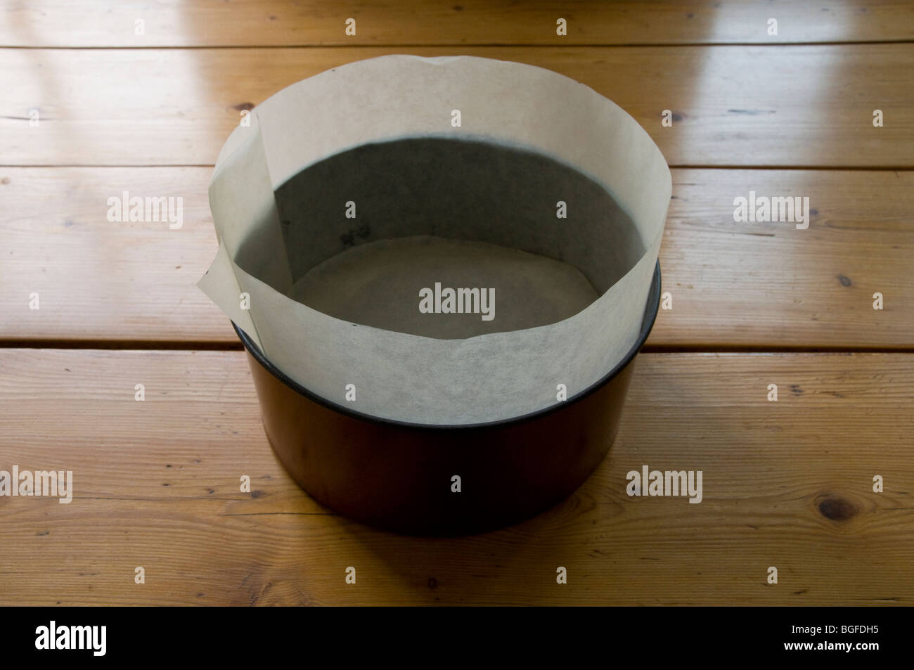 Greaseproof Paper Lining A Cake Tin In Readiness For Christmas Cake Mixture Or Other Cake Type Stock Photo Alamy