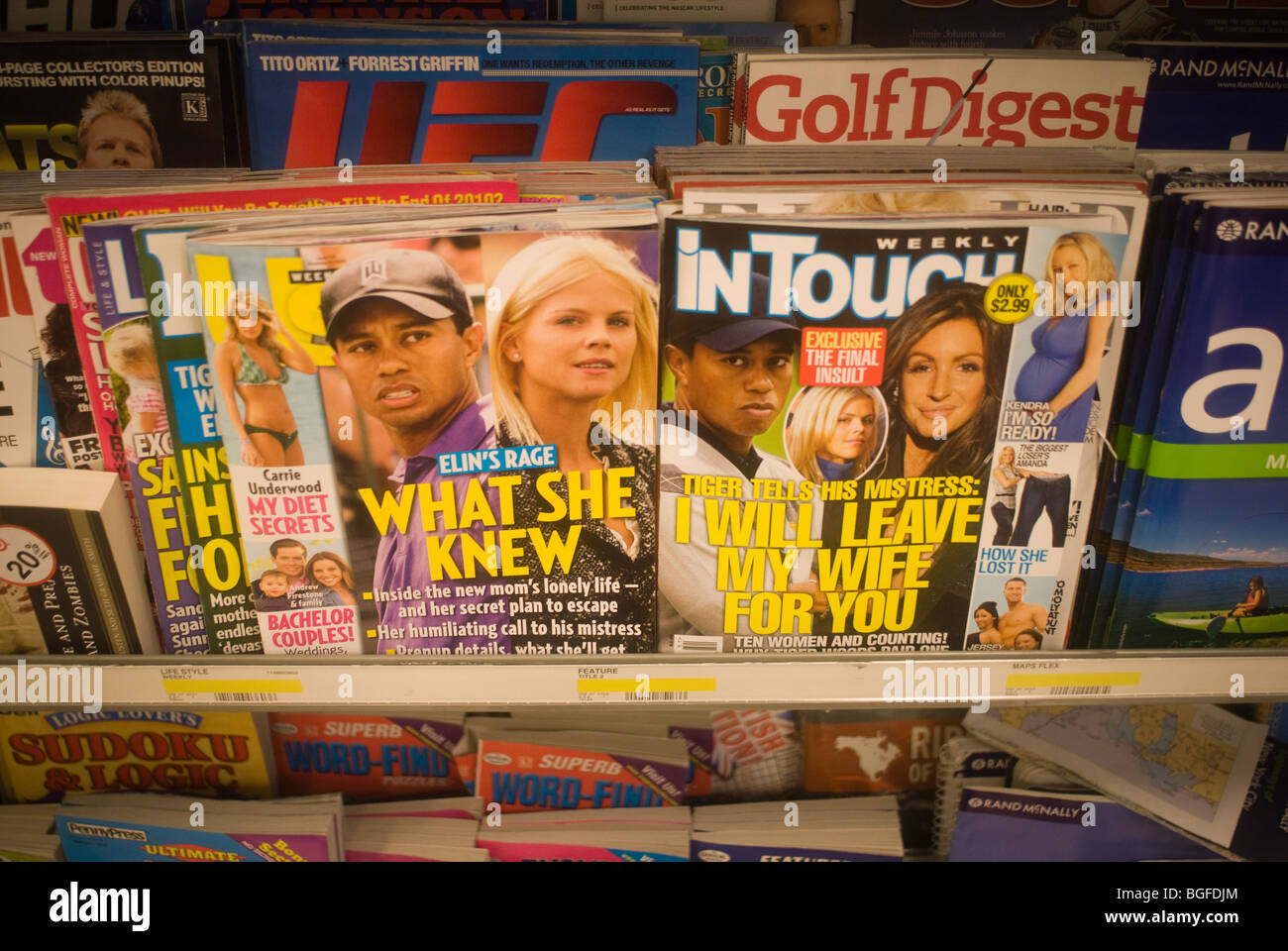 Tiger Woods is featured on the covers of US Weekly and In Touch Weekly magazines seen on a newsstand in New York Stock Photo