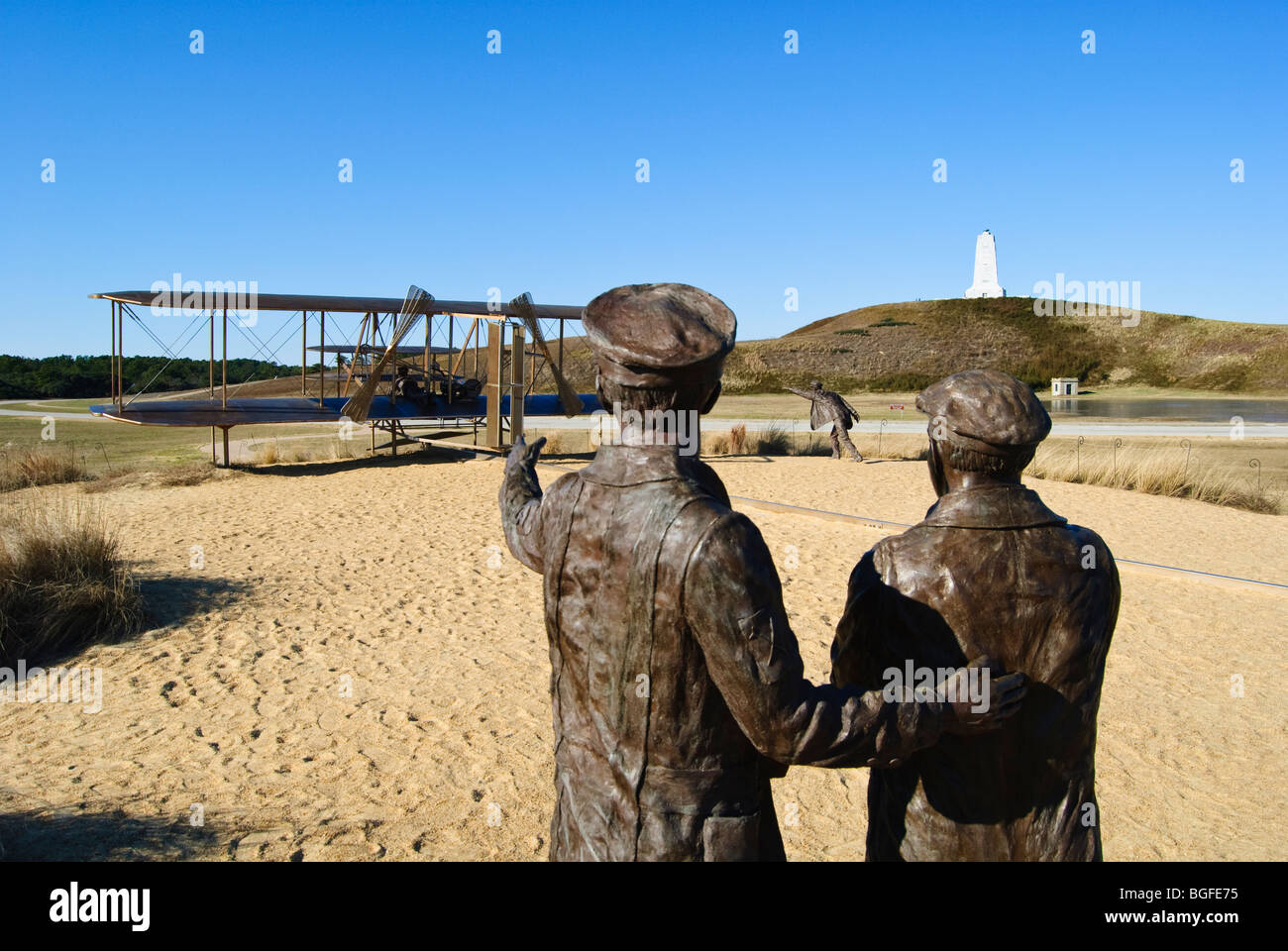 Sculpture depicting the first flight on the grounds of the Wrights Brothers National Memorial in Kitty Hawk, North Carolina, USA Stock Photo