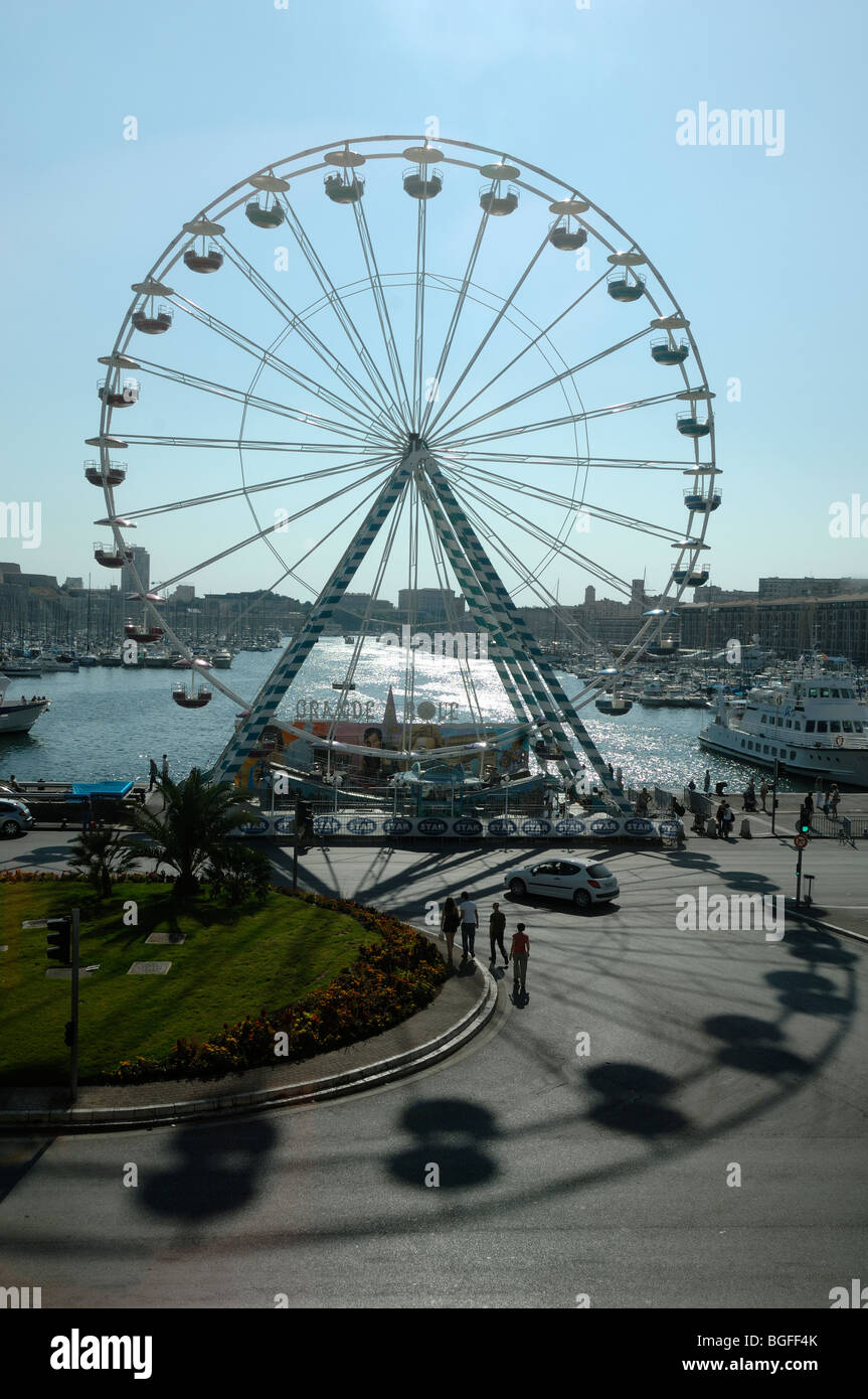 Silhouette of Ferris Wheel or Big Wheel on Quayside of the Old Port, Vieux Port, Harbour or Harbor, Marseille or Marseilles, Provence, France Stock Photo