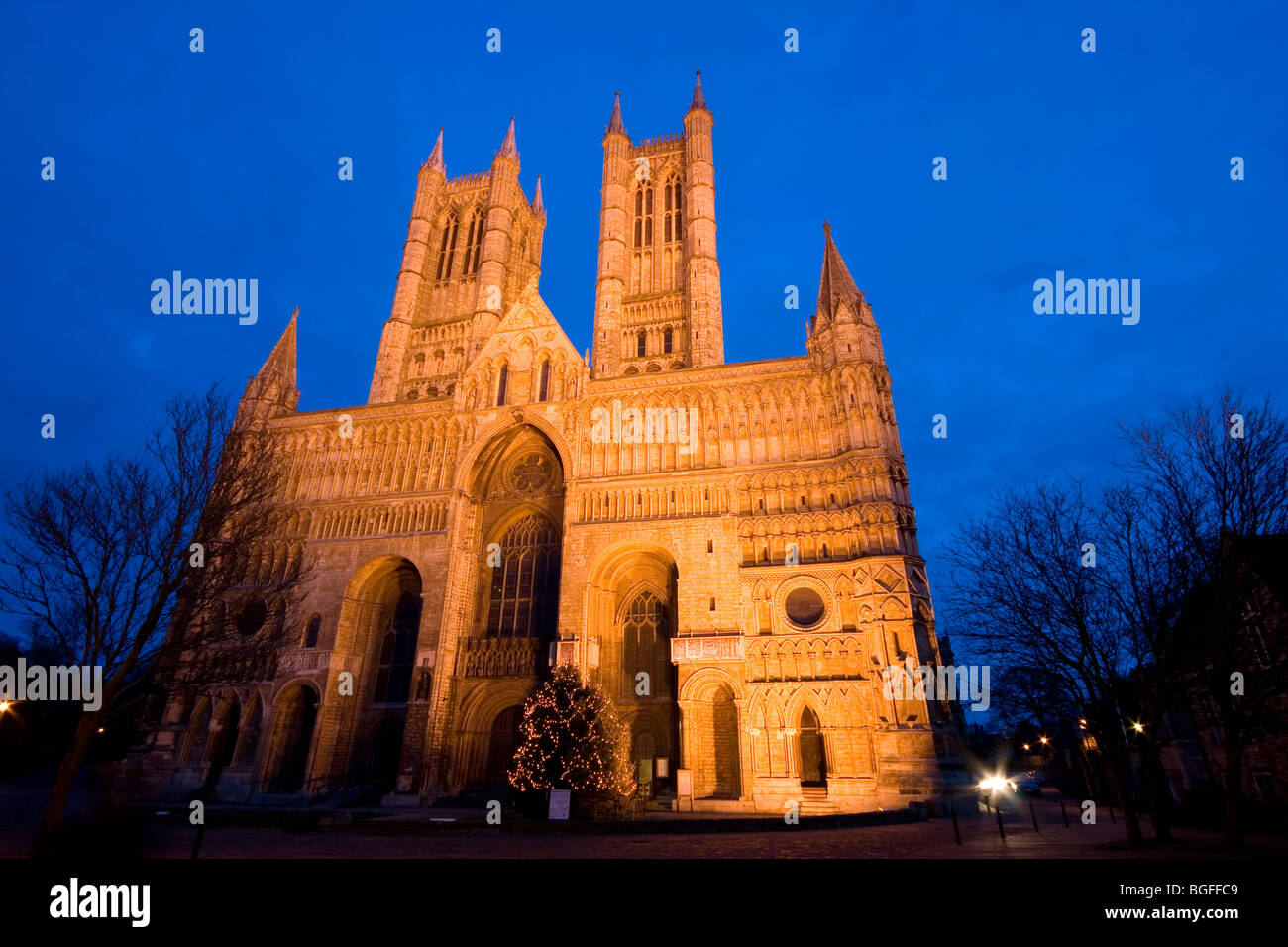 A dusk view of the floodlit Lincoln Cathedral, Lincolnshire, England, UK Stock Photo