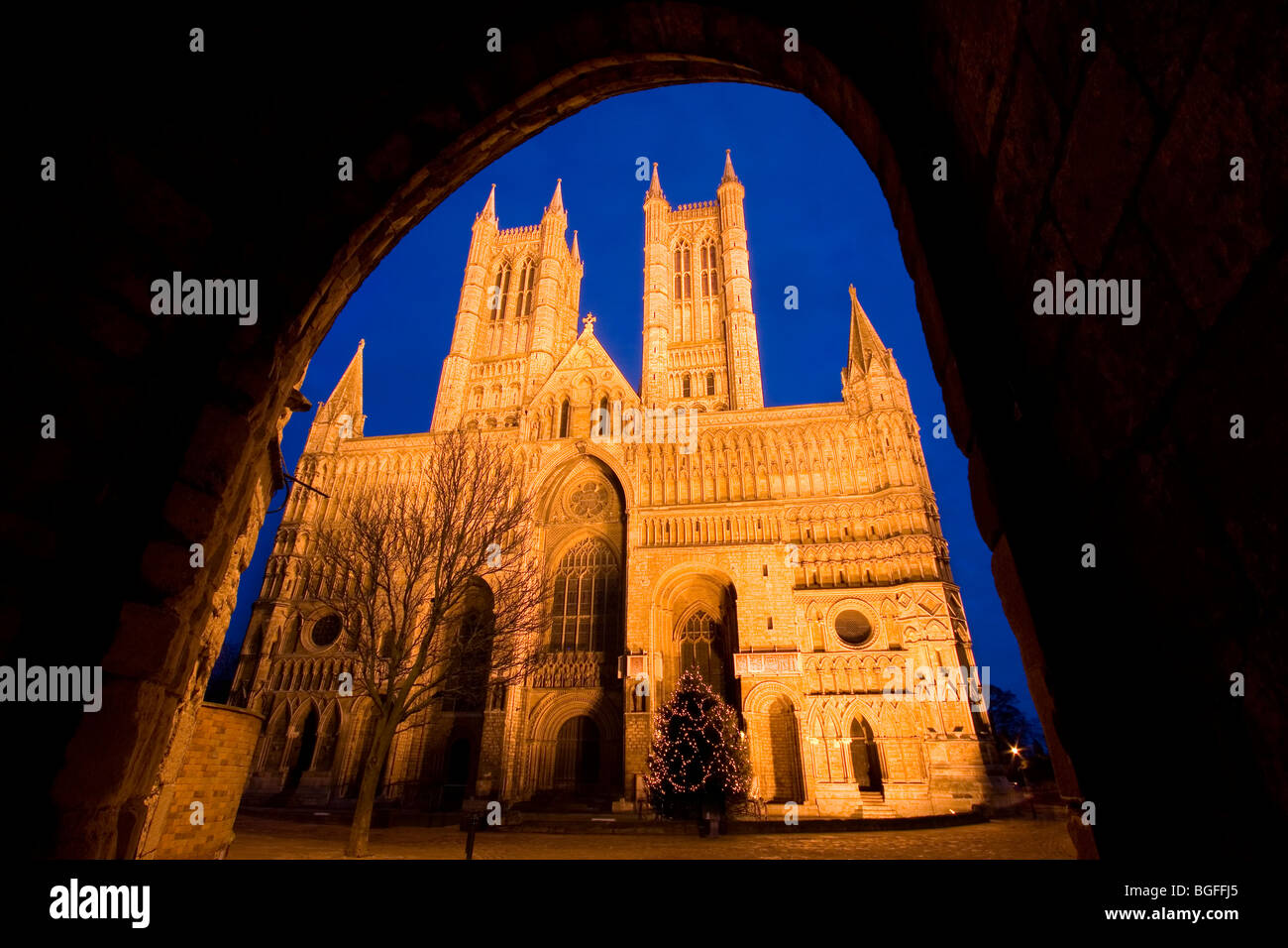 A dusk view of the floodlit Lincoln Cathedral, Lincolnshire, England, UK Stock Photo