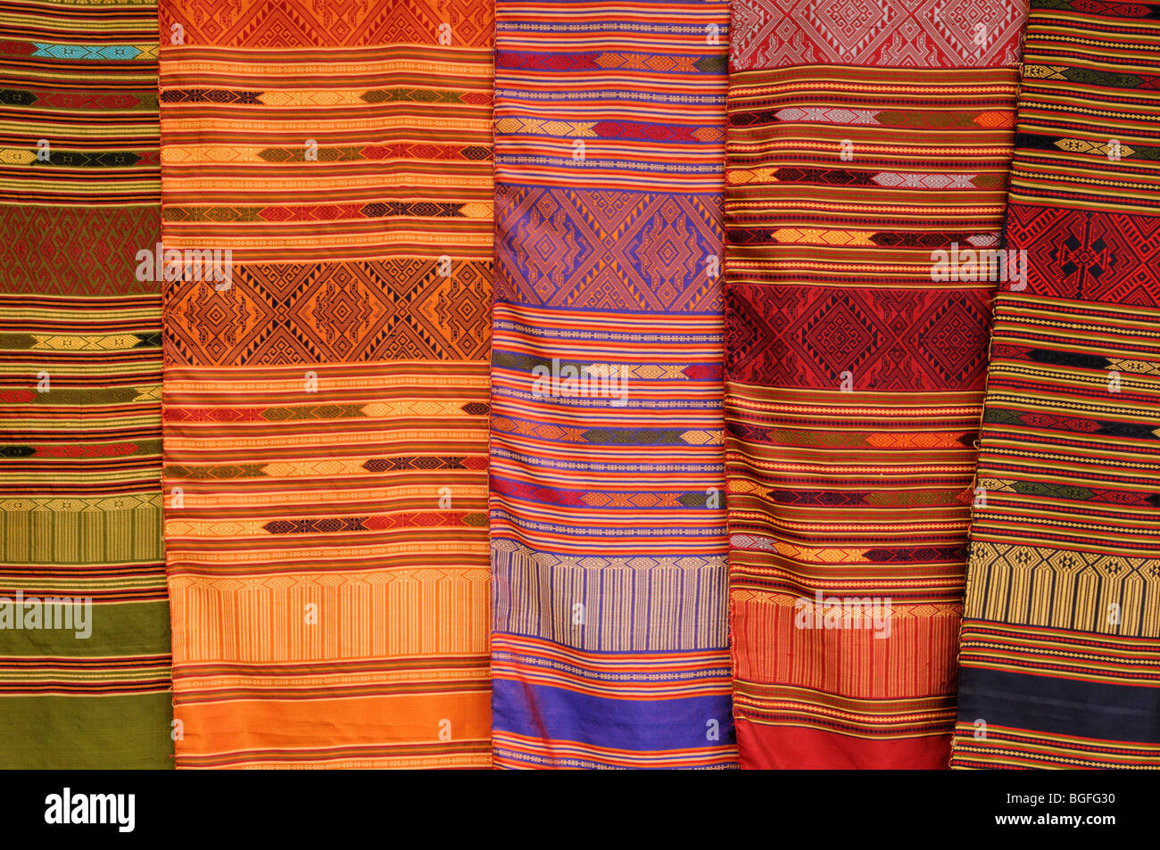Laos; Village of Phone Ngeun near Vang Vieng; Silk Scarves for sale Stock Photo
