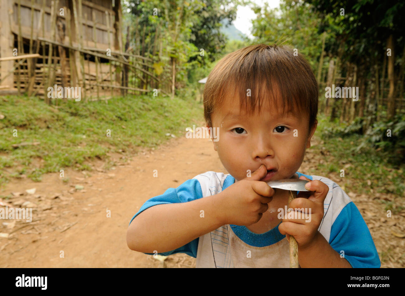 Laos; Village near Vang Vieng; Portrait of a local boy Stock Photo