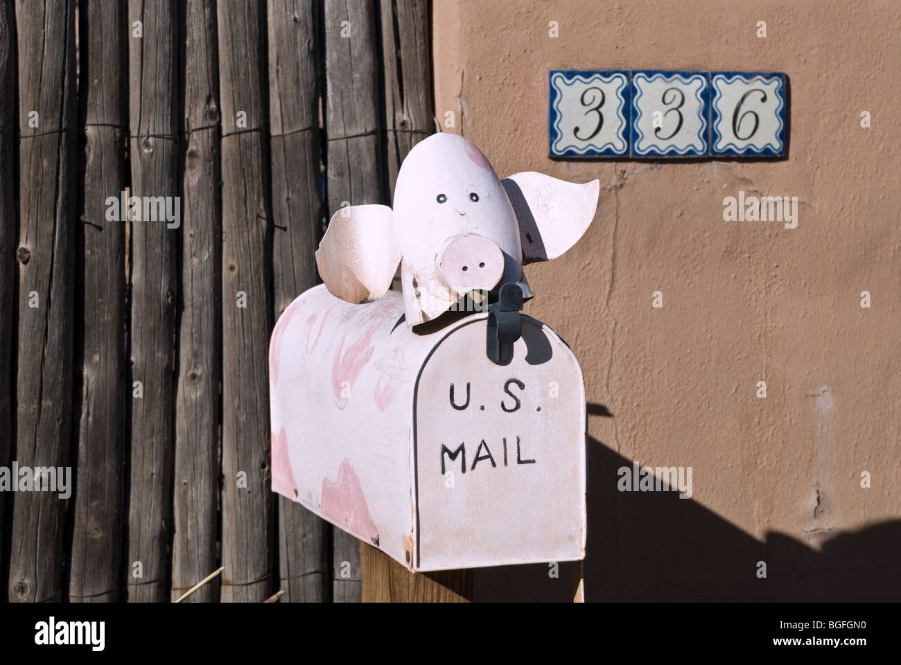 'If pigs could fly', this pig would deliver the mail for the residents of this home in Santa Fe, New Mexico. Stock Photo