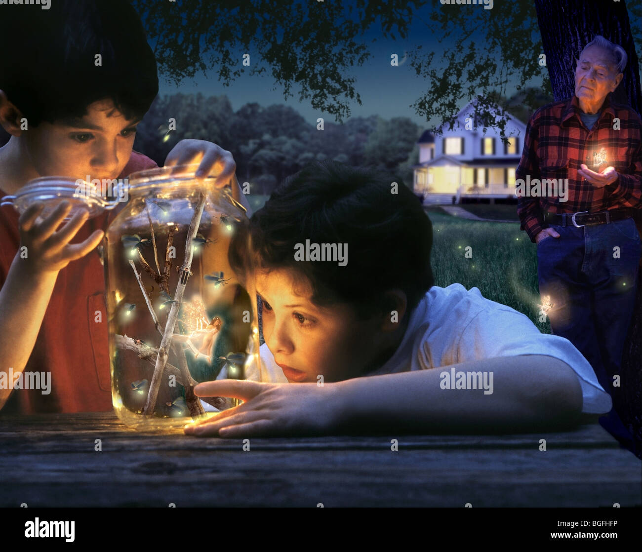 Two boys have collected fireflies but are discovering that they captured something special. Stock Photo
