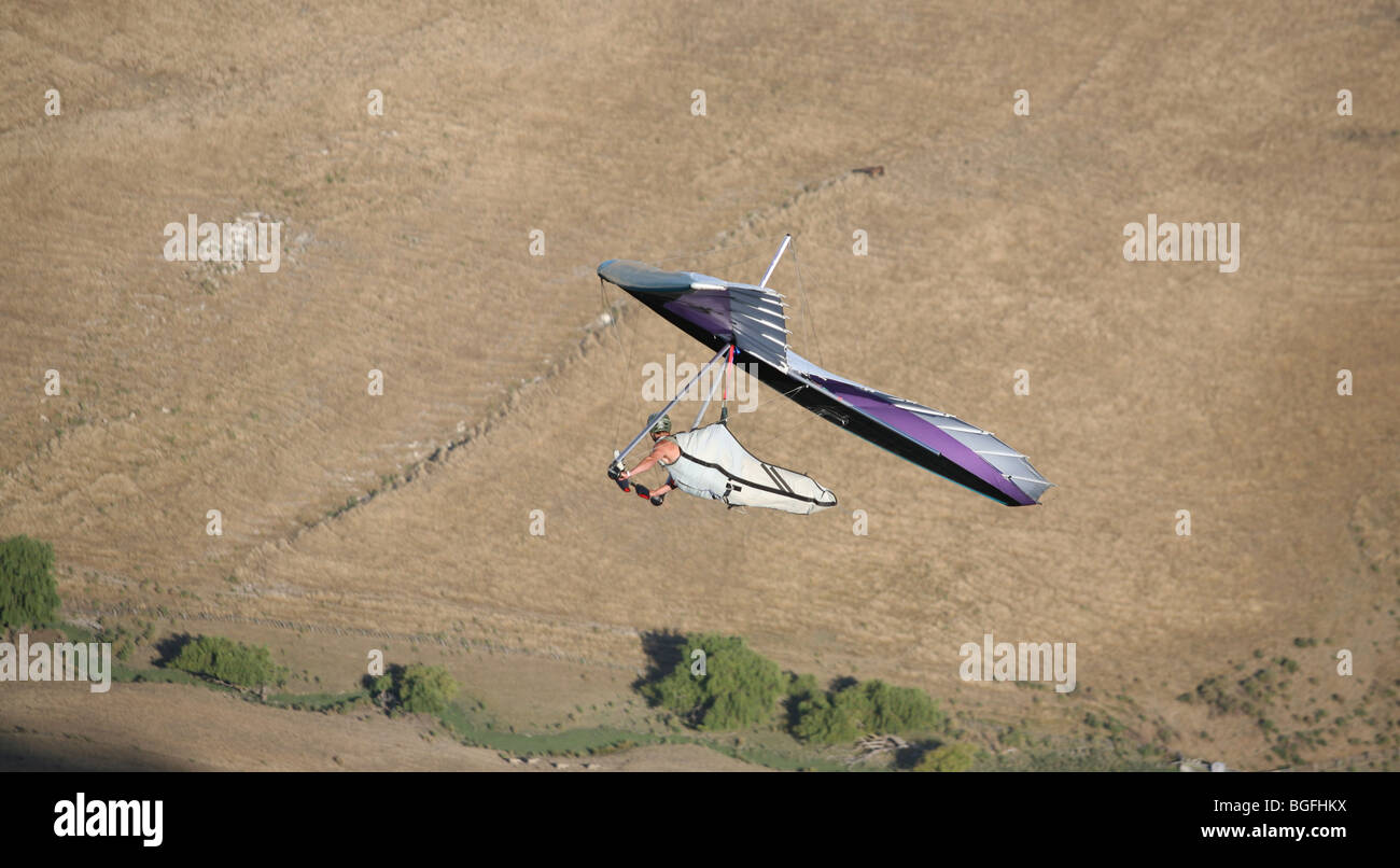 A hand glider enjoys the favorable flying conditions often found around Te Mata Peak in Hawkes Bay. Stock Photo