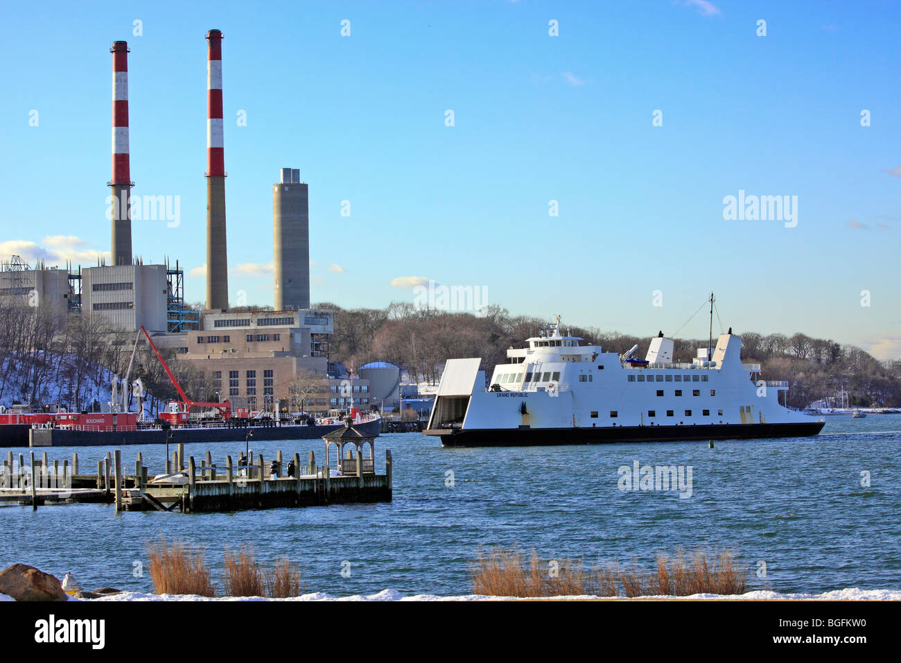 car and passenger ferry from bridgeport ct approaches dock at port