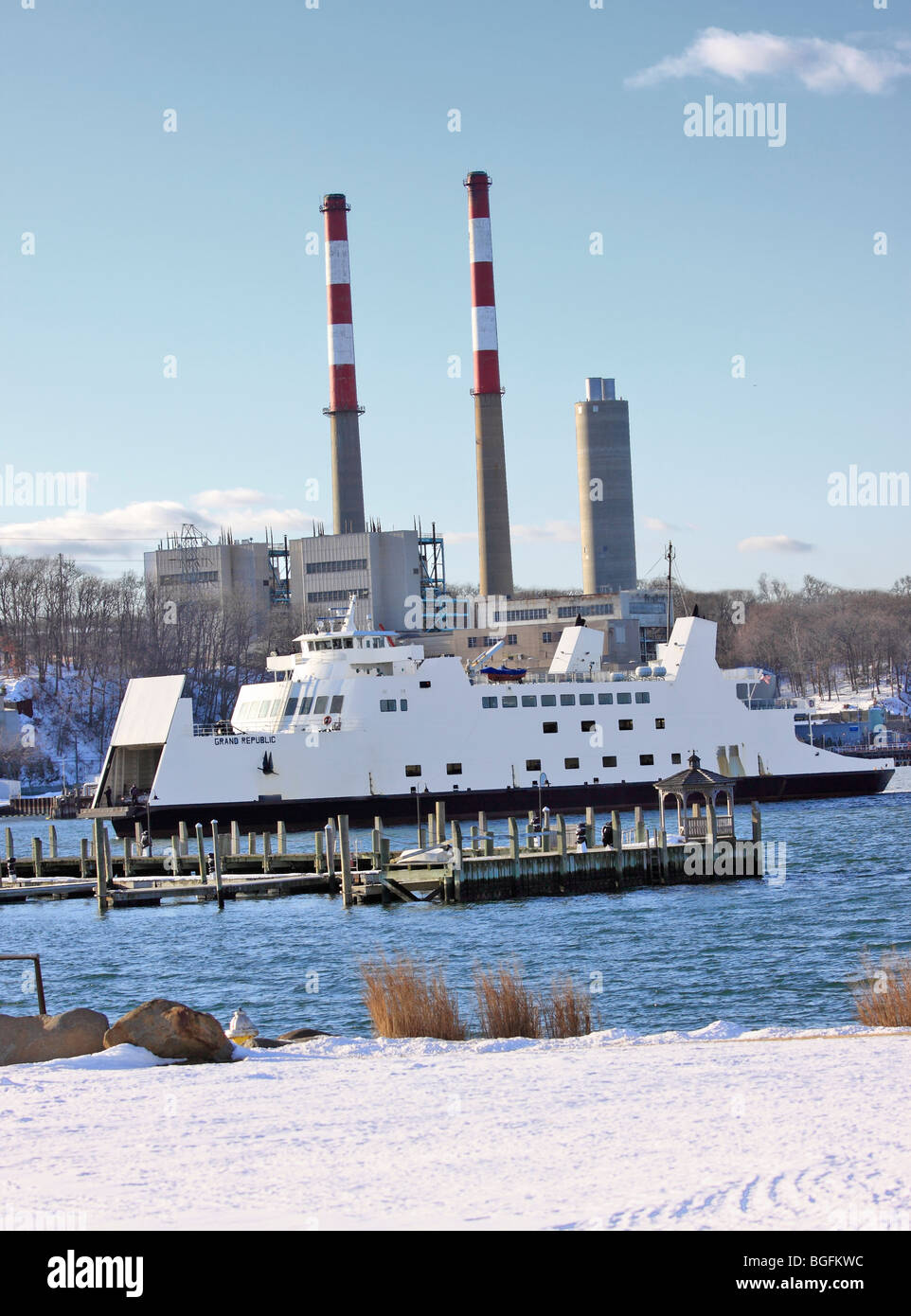 Car and passenger ferry from Bridgeport CT approaches dock at Port
