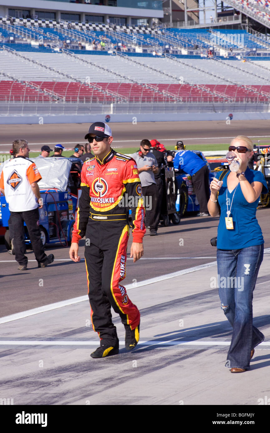 Aric Almirola walks through the pit area with his girlfriend Janice Goss before the Sept. 26, 2009 Las Vegas 350 truck race. Stock Photo