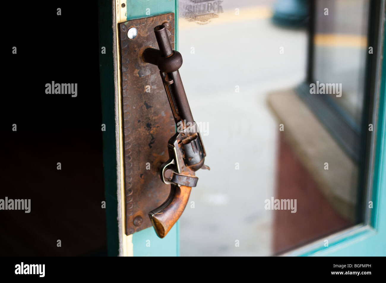 Door handle in the shape of a vintage revolver, in Deadwood, South