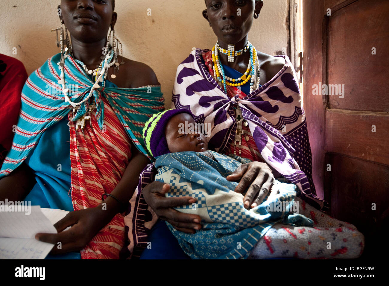 Maasai Women wait to be seen by a doctor in a clinic in Kilombero Village, Manyara Region, Tanzania. Stock Photo
