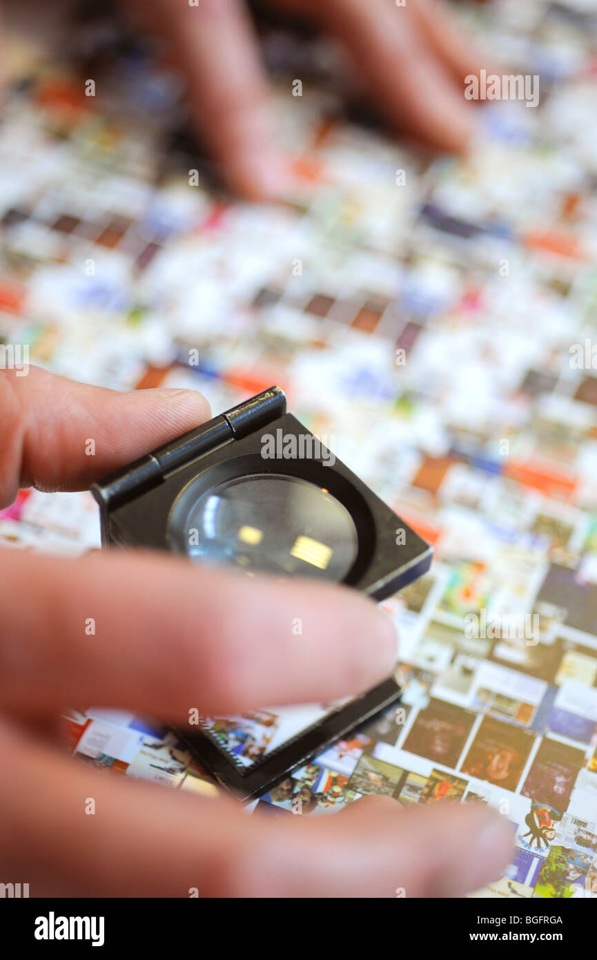 Printing a print finisher at work checking material with a magnifying