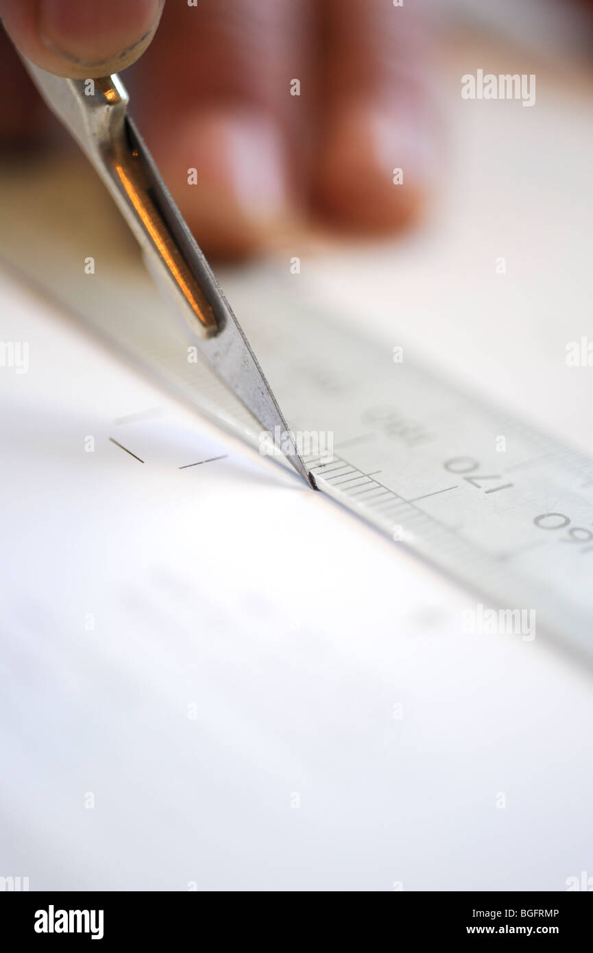 Printing a print finisher at work cutting, trimming and preparing work