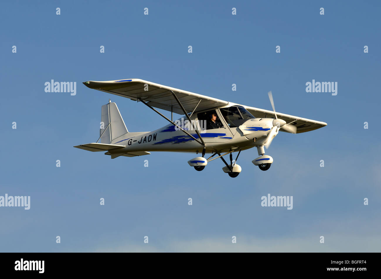 Ikarus C42 aircraft G-JADW approaching Wellesbourne Airfield, Warwickshire, UK Stock Photo