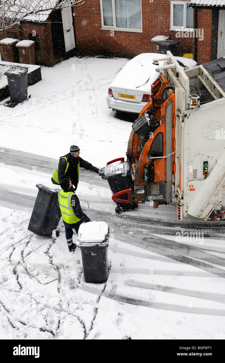 Refuse Collection in the snow Stock Photo