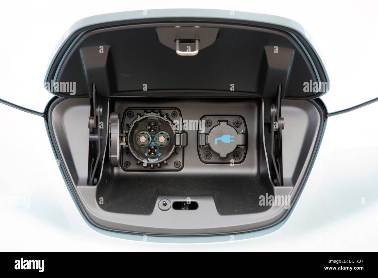 Close up of electric charging plugs compartment, in lieu of a gas tank