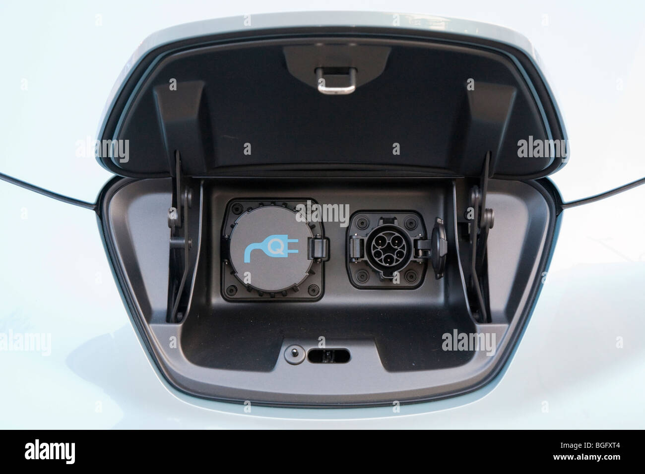 Close up of the electric charging plugs compartment, in lieu of a gas