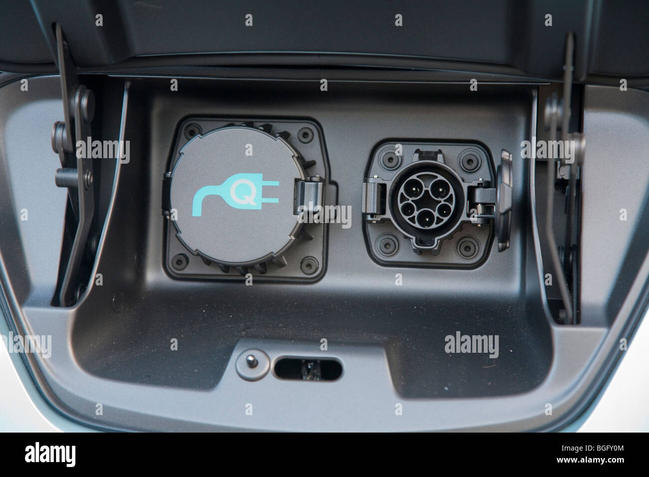Close up of the electric charging plugs compartment, in lieu of a gas