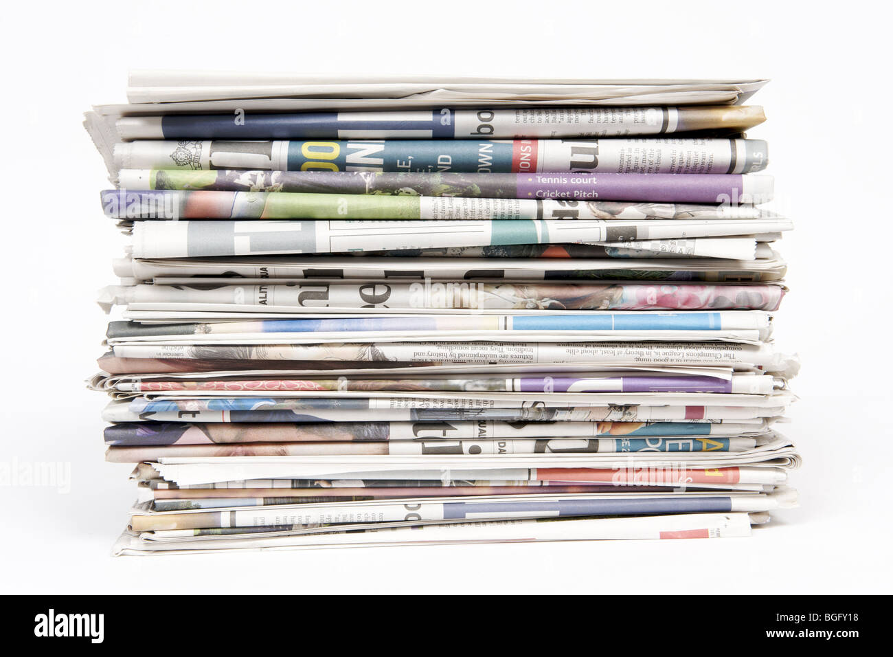 Stack of newspapers on a white background Stock Photo