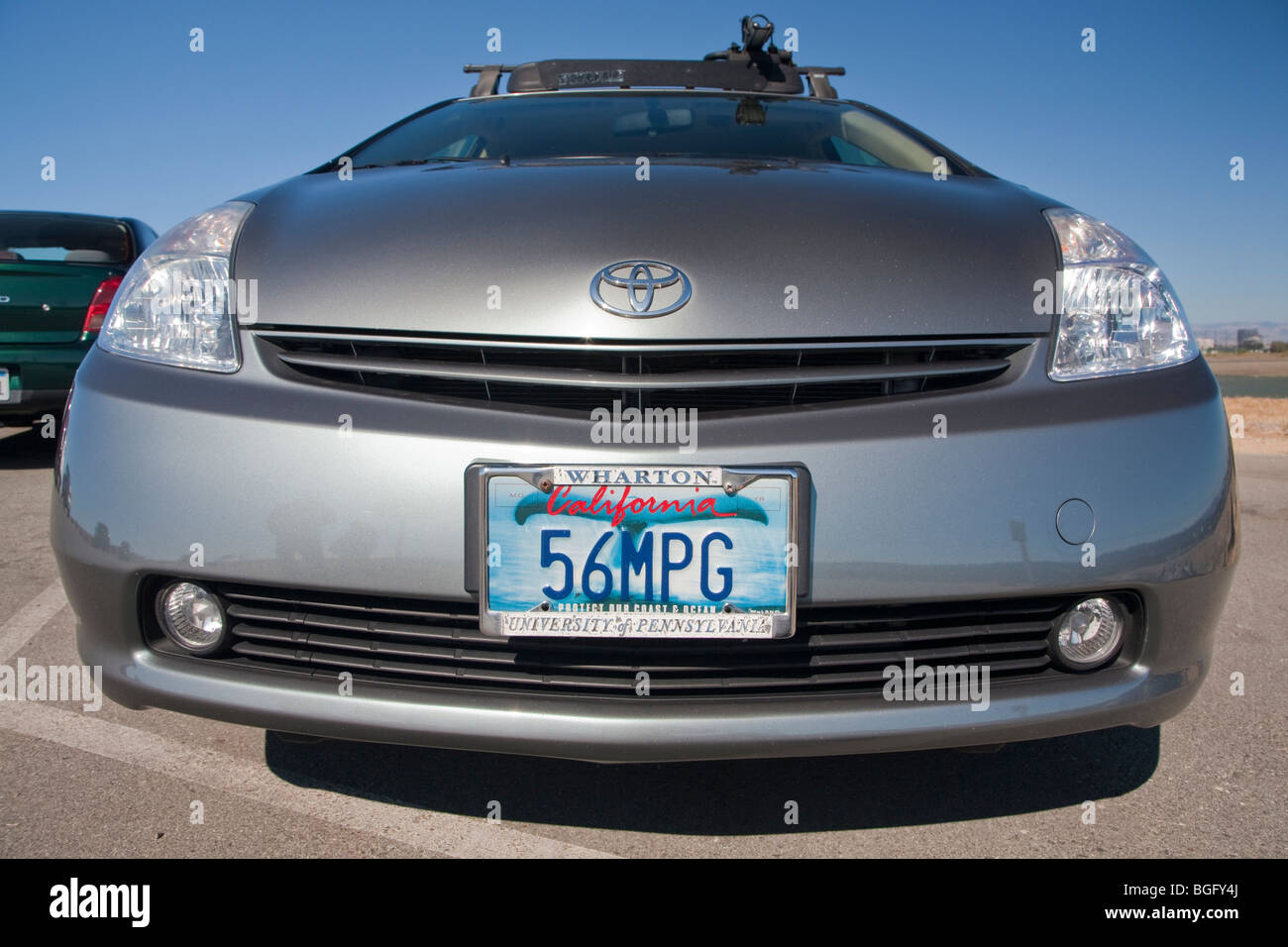 Front view of Kendrick Li's 2004 Toyota Prius has a '56 MPG' (56 miles per gallon) custom license plate. Stock Photo