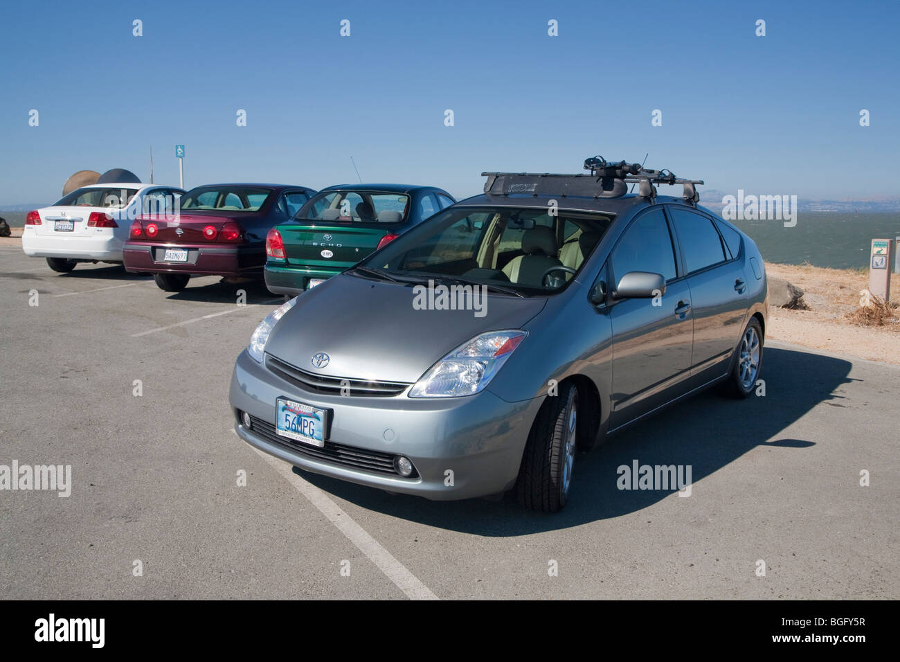 2004 Toyota Prius has a '56 MPG' custom license plate. People pay for customized plates and proceeds support various causes. Stock Photo