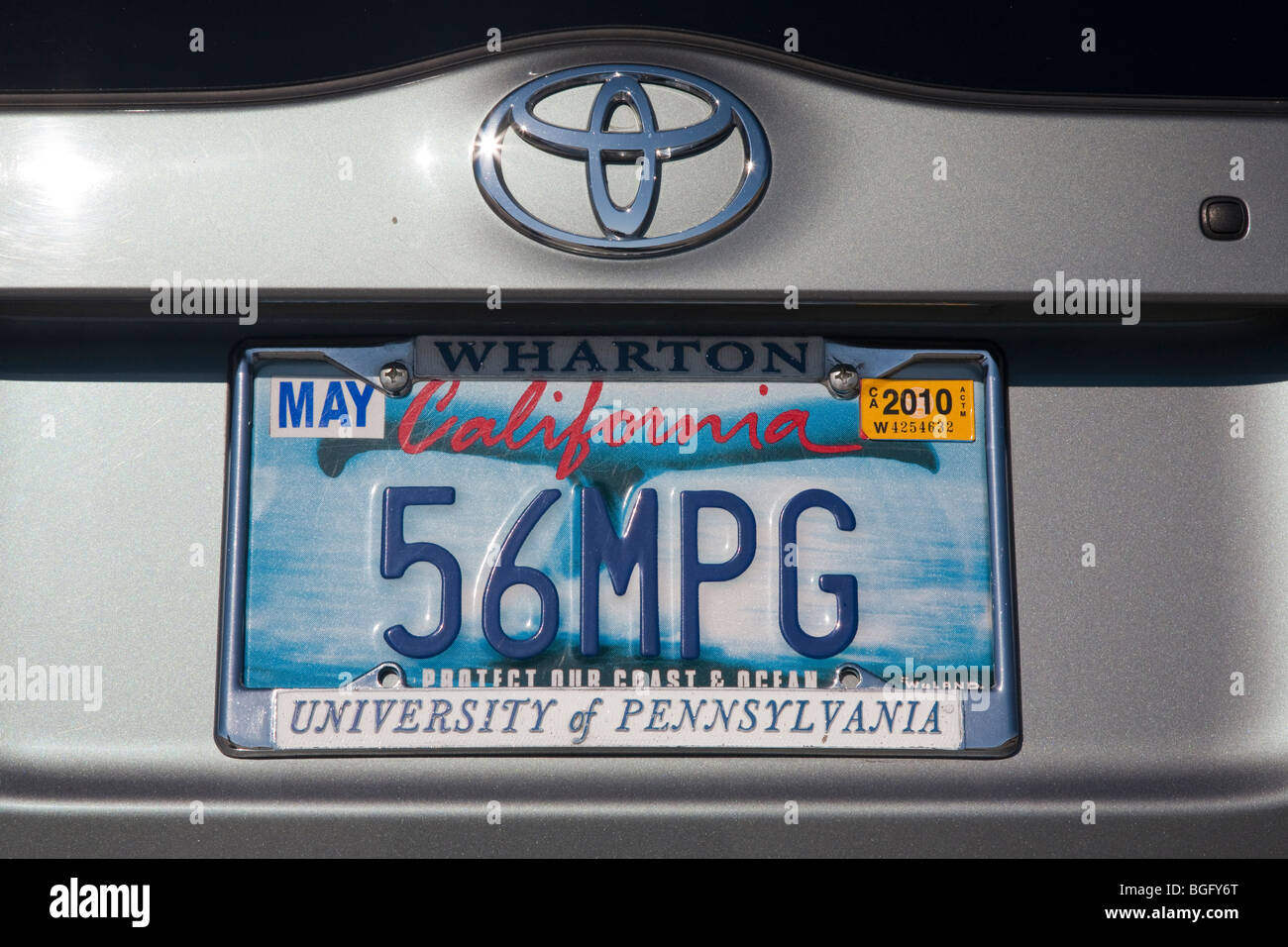 2004 Toyota Prius has a '56 MPG' custom license plate. People pay for customized plates and proceeds support various causes. Stock Photo