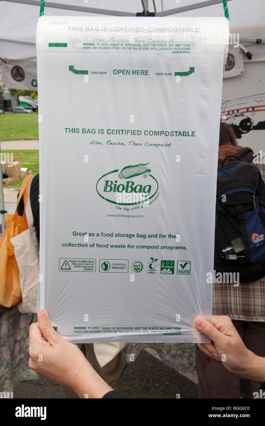 Close up of BioBag biodegradable and compostable plastic bags for carrying produce on a roll at Berkeley's Farmers' Market. Stock Photo