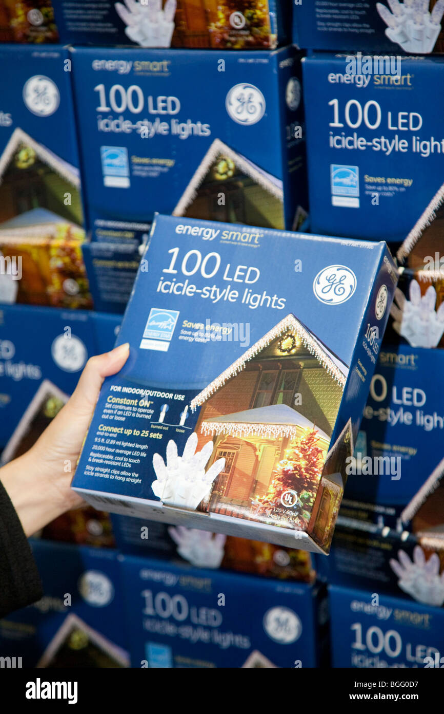 Mid adult woman shopping energy efficient LED holiday lights at Costco. San Francisco, California, USA Stock Photo