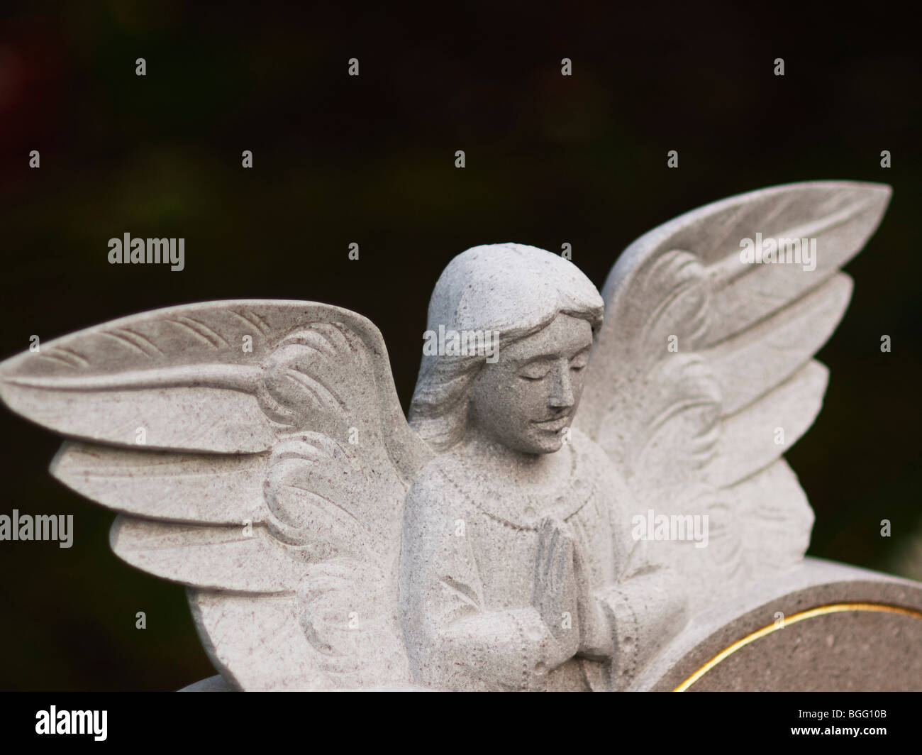an angel on a gravestone in a country cemetery Stock Photo Alamy