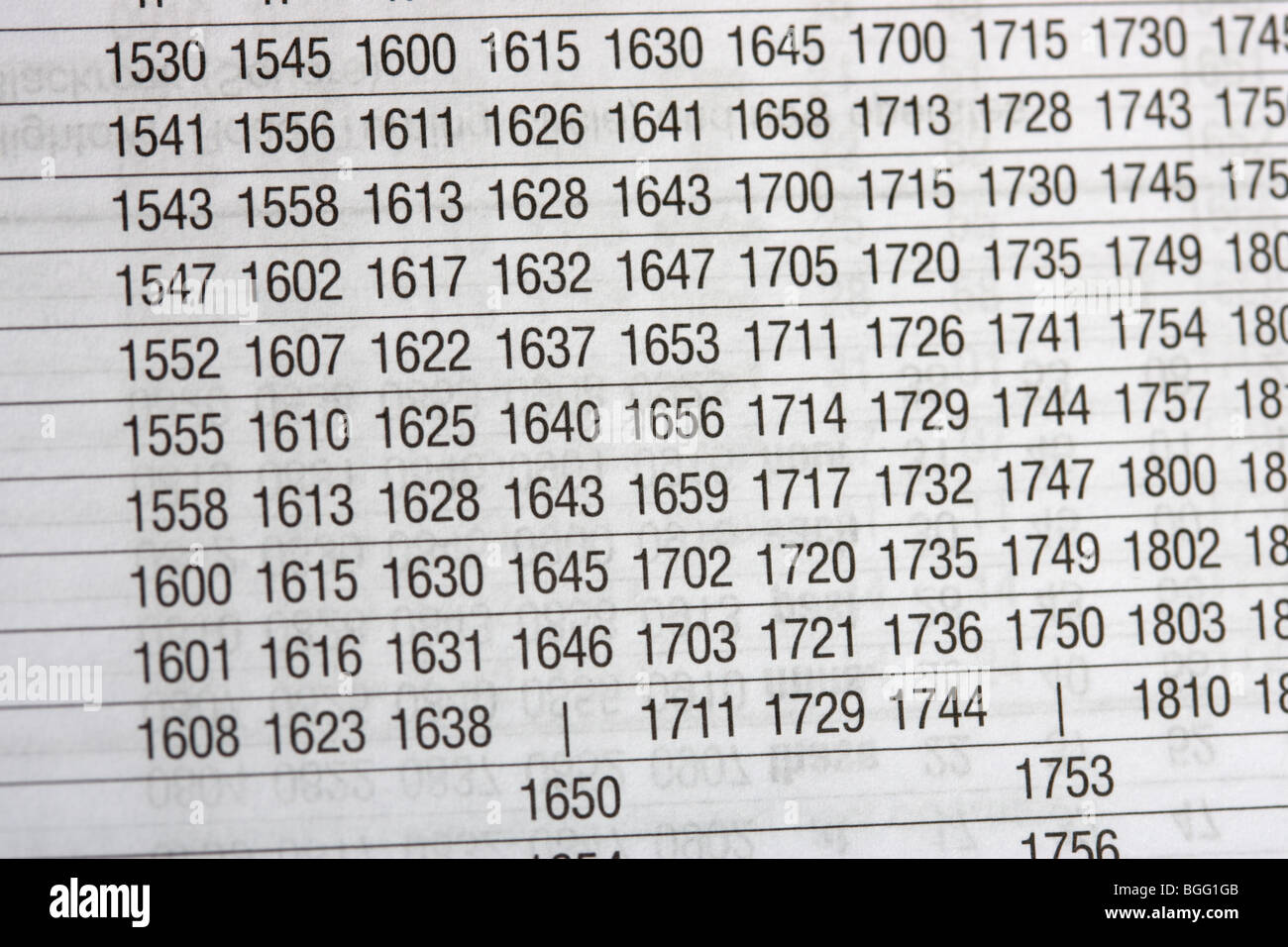 rows of times in a regular timetable as used by bus and rail companies printed Stock Photo