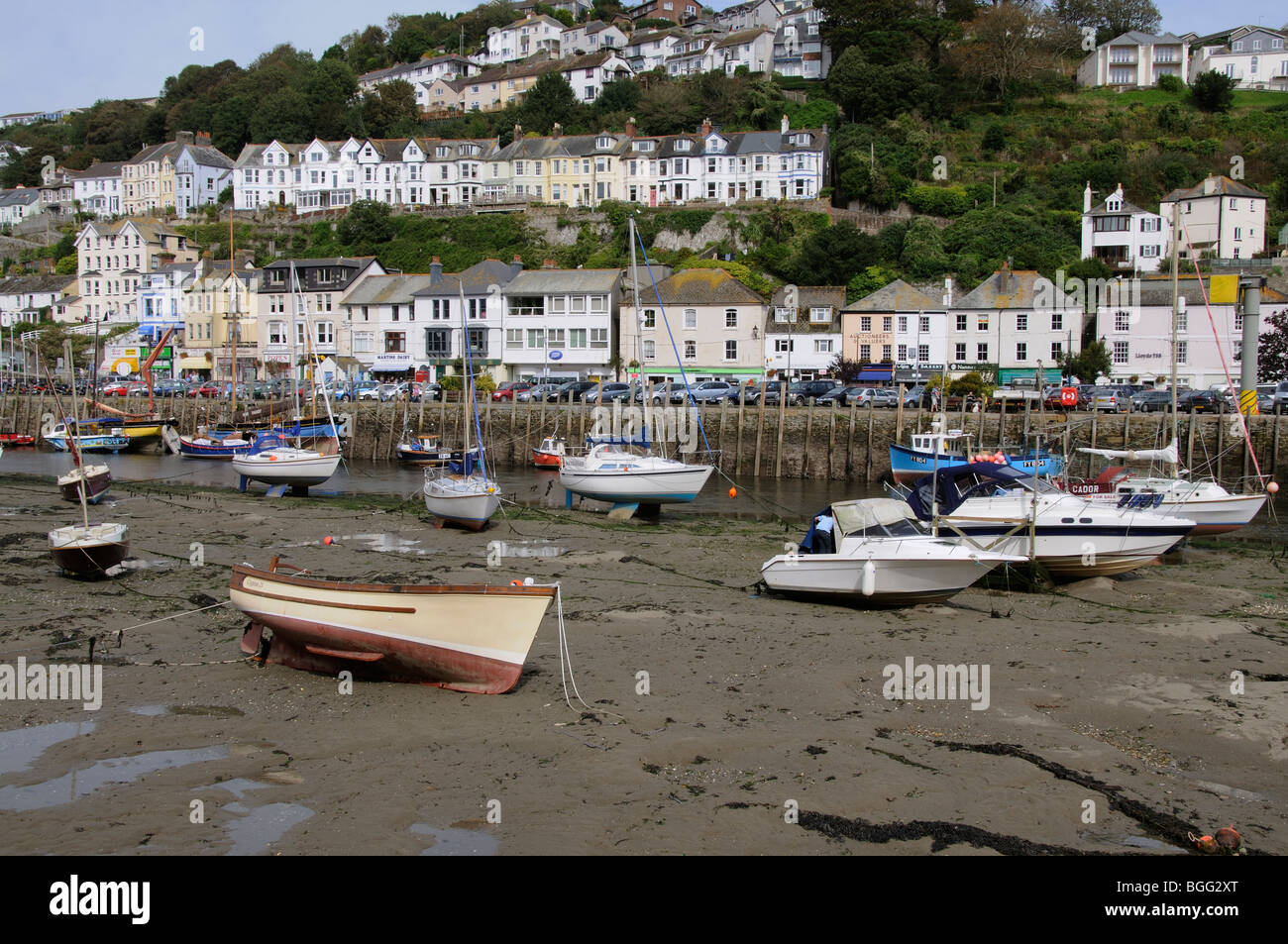 Low tide on Looe River Boats on the waterfront in this popular west country seaside resort in Cornwall England UK Stock Photo