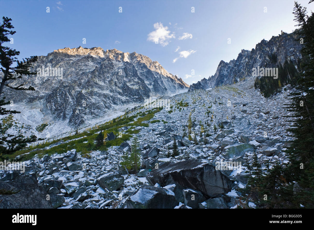 Dragontail Peak and the boulder / talus field above Colchuck Lake covered in an Autumn snow, Washington Cascades, USA. Stock Photo