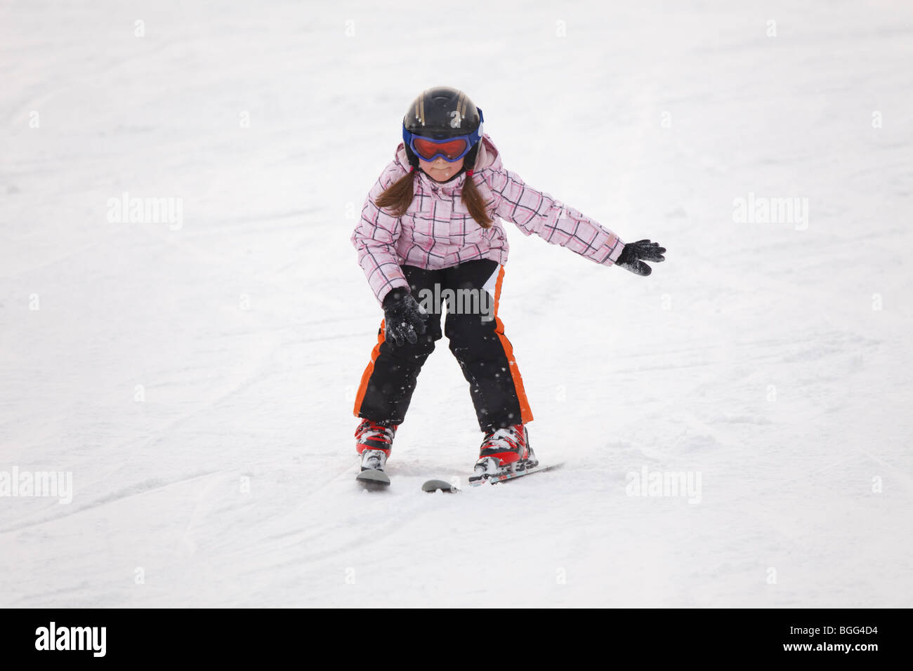 Little girl learning alpine skiing Stock Photo