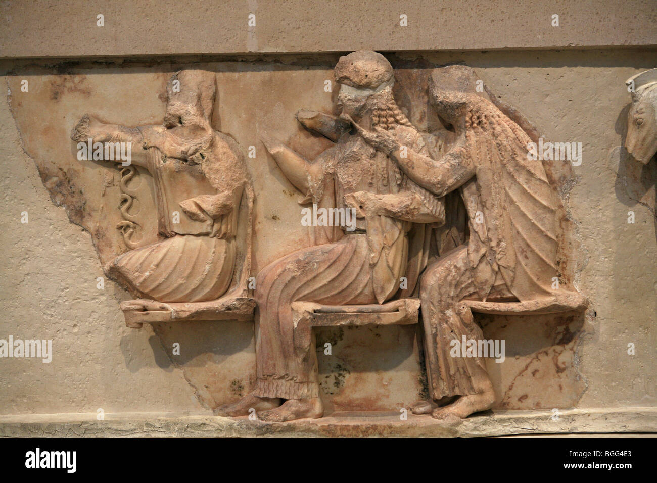 Scenes from the Trojan war - Goddesses protecting the Achaeans Athena Hera and Demeter . From the Treasury's pediments Stock Photo