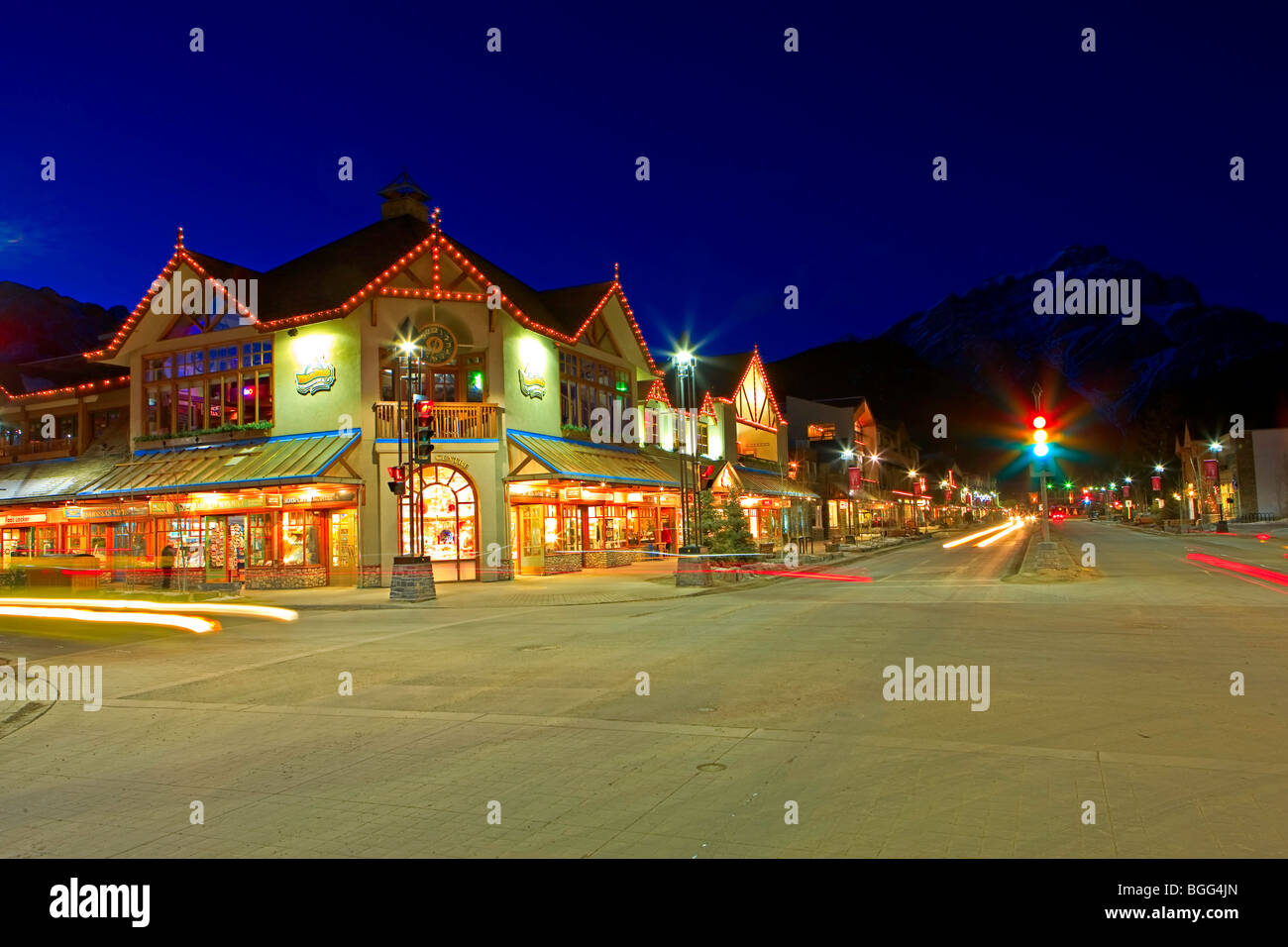Looking north from the corner of Banff Avenue and Caribou Street towards Cascade Mountain (2998 metres/9836 feet) at night, Town Stock Photo